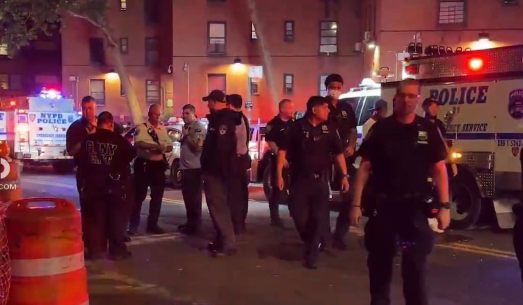 A group of police officers standing in a street after pedestrians were struck by a car in Lower Manhattan, reported on 7/4/24 via Citizen App