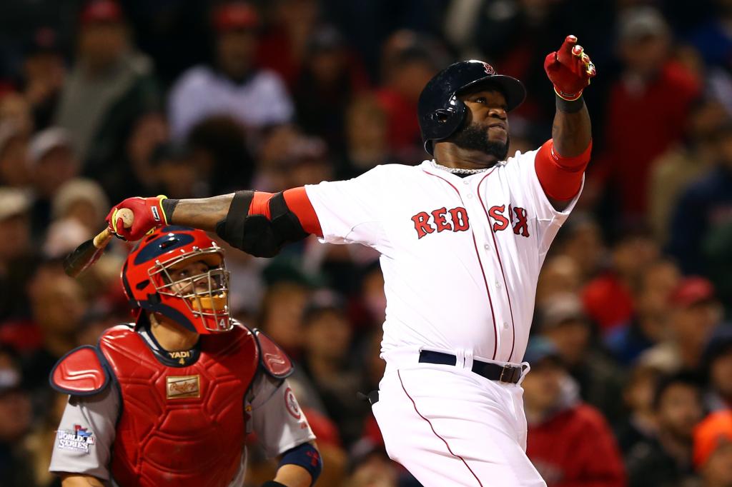 David Ortiz #34 of the Boston Red Sox hits a home run in the seventh inning against the St. Louis Cardinals during Game One of the 2013 World Series at Fenway Park on October 23, 2013 in Boston, Massachusetts. 