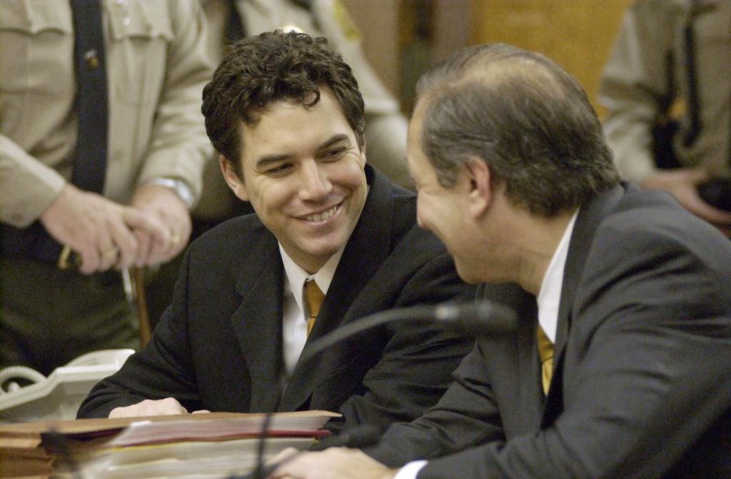 Peterson smiles with his attorney during arraignment at the Stanislaus Superior Court on Dec. 3, 2003 in Modesto, Calif.