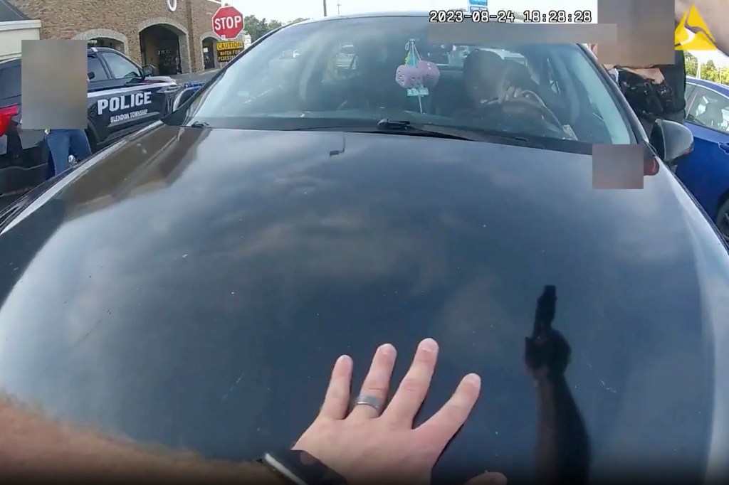 This still image from bodycam video released by the Blendon Township Police on Friday, Sept. 1, 2023, shows an officer pointing his gun at Ta'Kiya Young moments before shooting her through the windshield outside a grocery store in Blendon Township, Ohio, a suburb of Columbus, on Aug. 24.