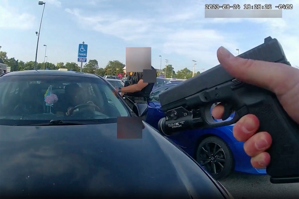 This still image from bodycam video released by the Blendon Township Police on Friday, Sept. 1, 2023, shows an officer pointing his gun at Ta'Kiya Young moments before shooting her through the windshield outside a grocery store in Blendon Township, Ohio, a suburb of Columbus, on Aug. 24.  