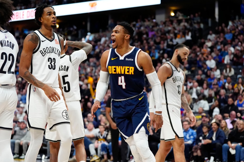 Denver Nuggets guard Russell Westbrook (4) reacts next to Brooklyn Nets center Nic Claxton (33) in the second quarter at Ball Arena. 