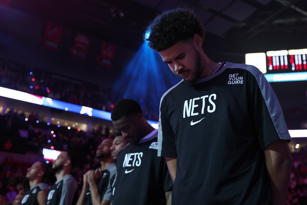 Cam Johnson, who did not play because of a sprained right ankle, stands for the national anthem during the Nets' 126-67 blowout loss to the Clippers on Jan. 15, 2025.