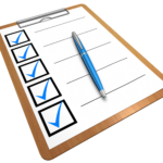 A clipboard with a checklist featuring several checked boxes and a blue pen on top.