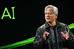 An asian man in a black leather jacket.