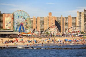 New York, NY, USA - August 30, 2016: Beach in Coney Island: People enjoy beach: Coney Island is a peninsular residential neighborhood, beach, and leisure/entertainment.