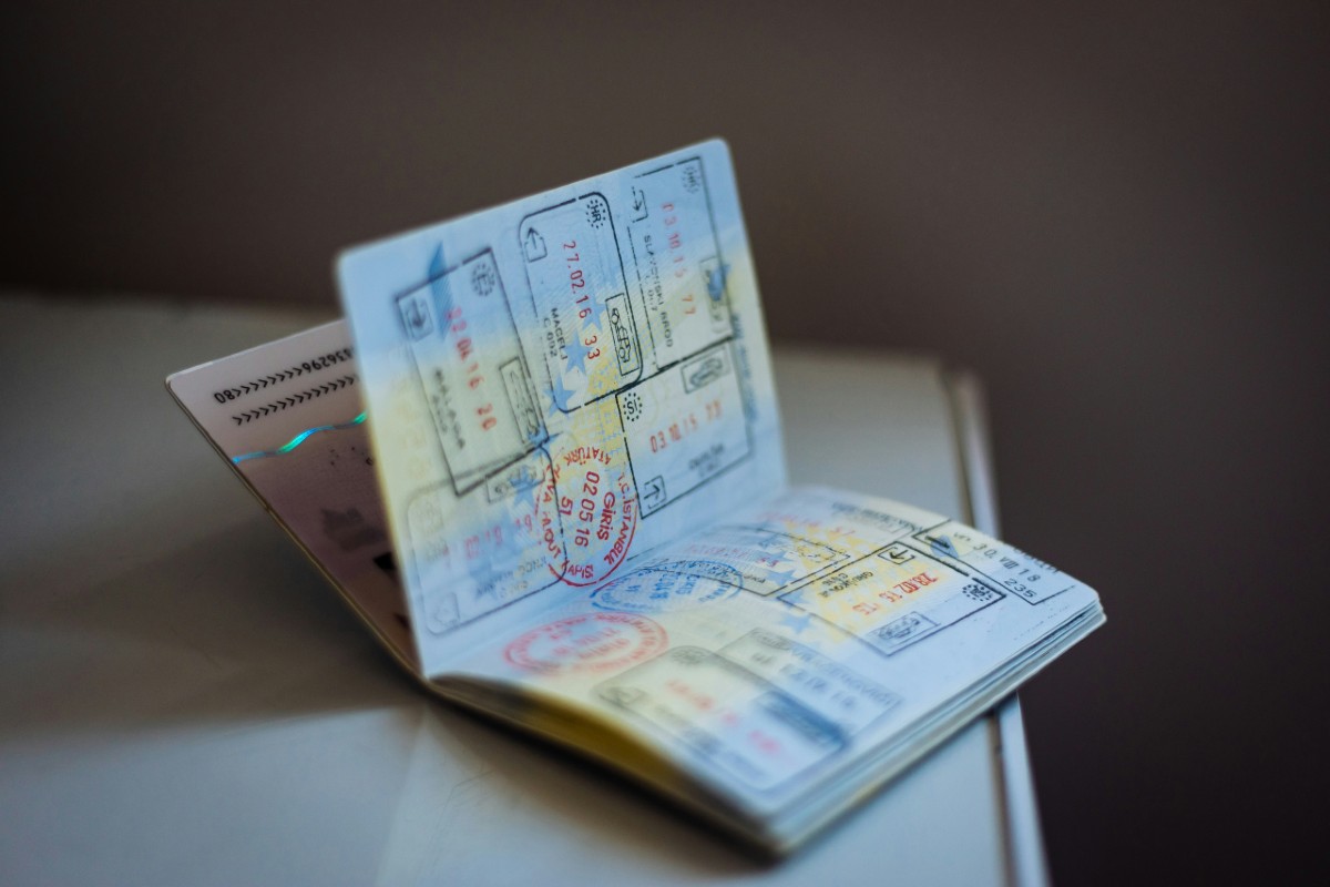 pages of passport filled with stamps