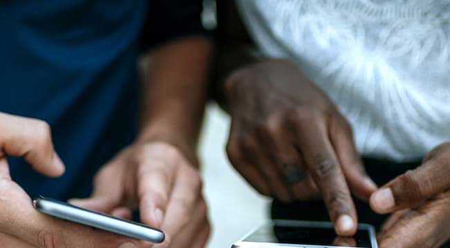 male hands holding a smart phone 