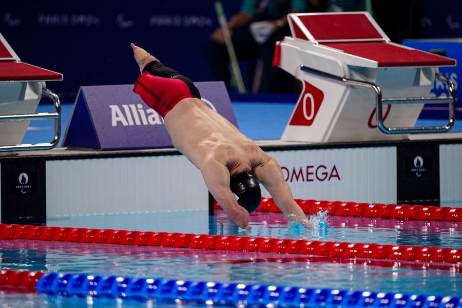 Japan's Takayuki Suzuki competes during the men's 200m freestyle S4 final event at the Paris 2024 Paralympic Games at The Paris La Defense Arena in Nanterre west of Paris on September 3 2024