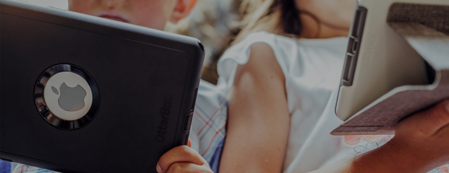 Children holding iPads