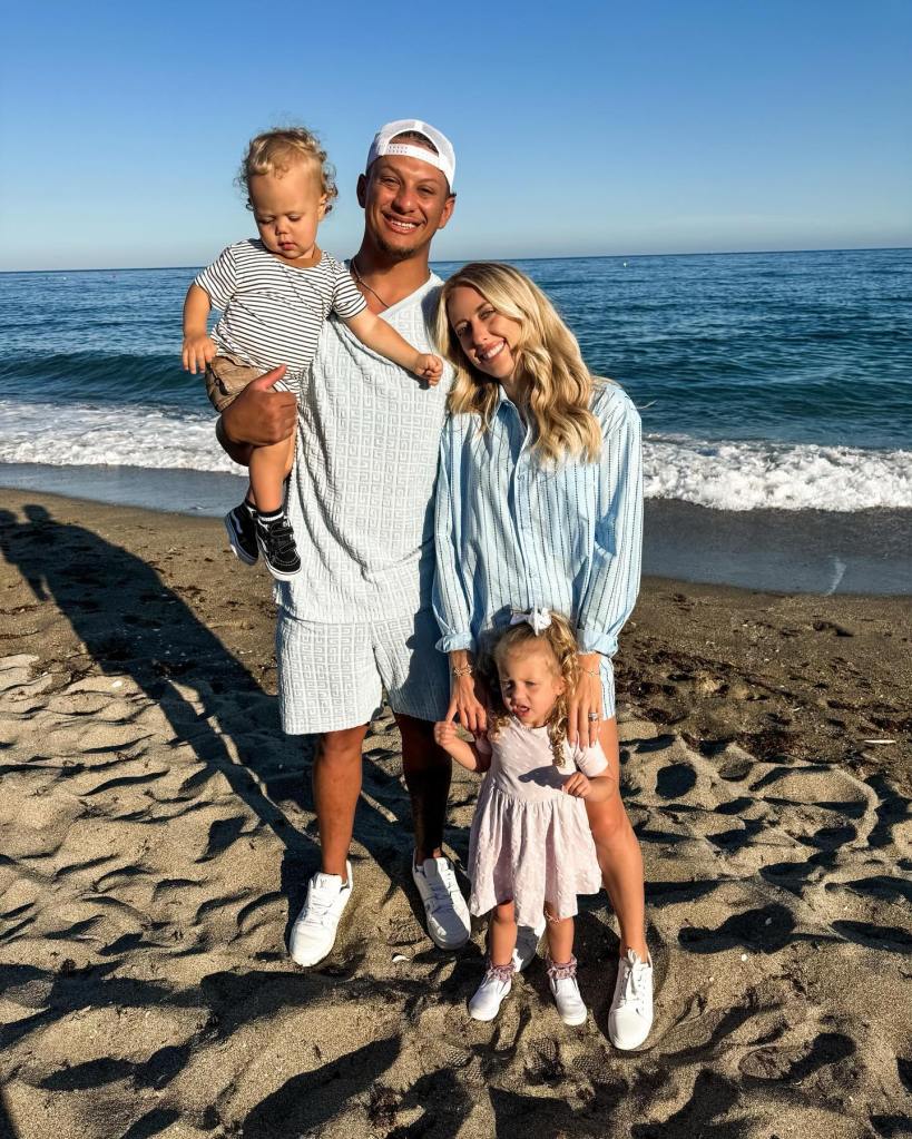 Brittany and Patrick Mahomes on a Spain beach with their two kids Sterling and Bronze. 