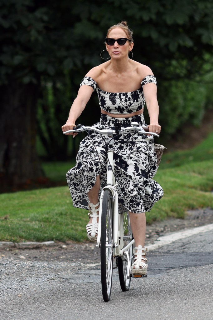 Jennifer Lopez in a Misa floral skirt set while biking in the Hamptons. 