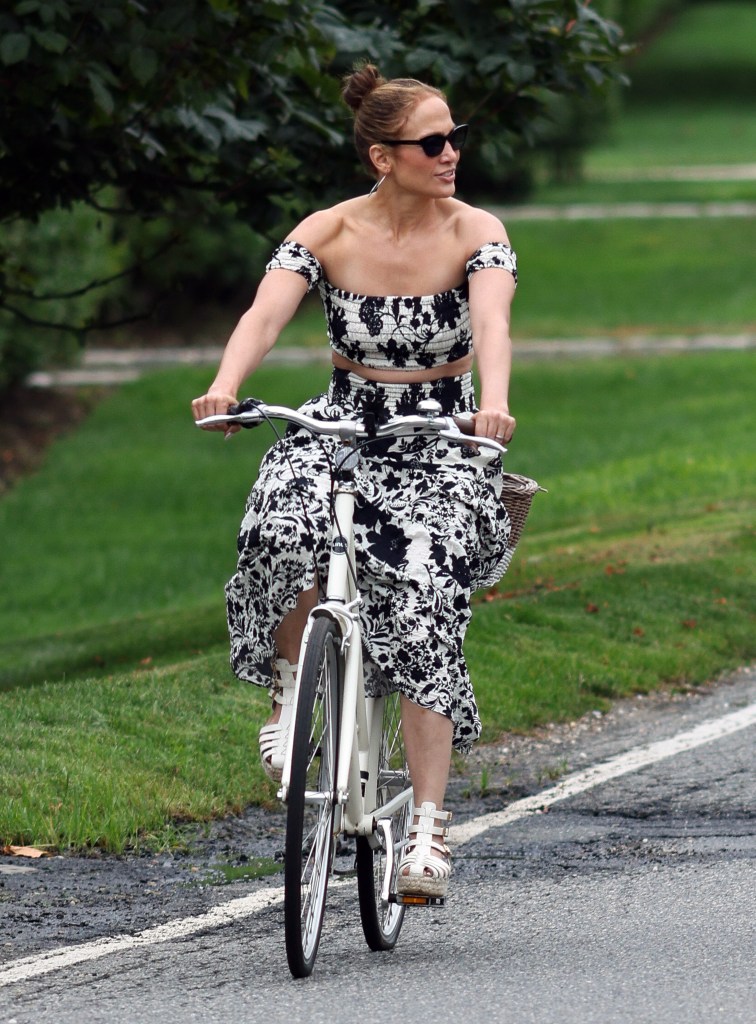 Jennifer Lopez in a Misa floral skirt set while biking in the Hamptons. 