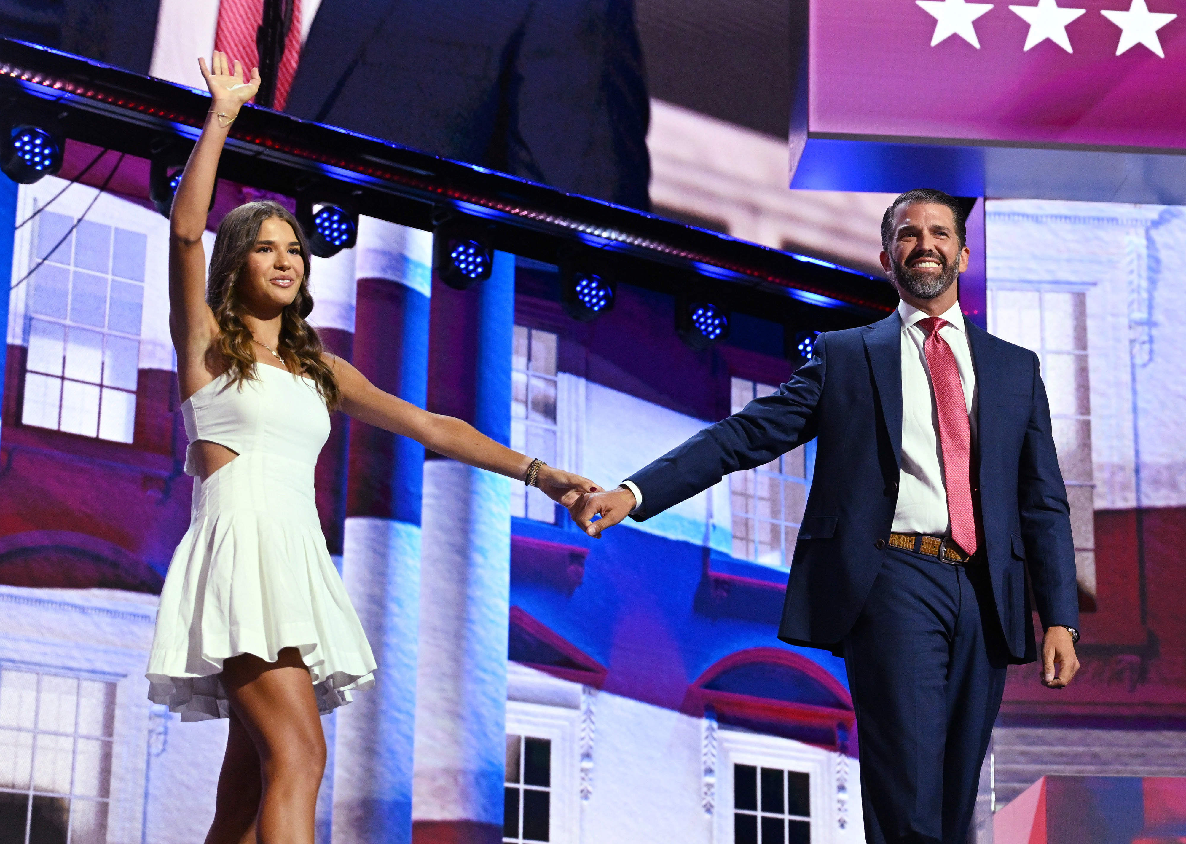 Kai Madison Trump and Donald J. Trump, Jr standing on stage at the RNC