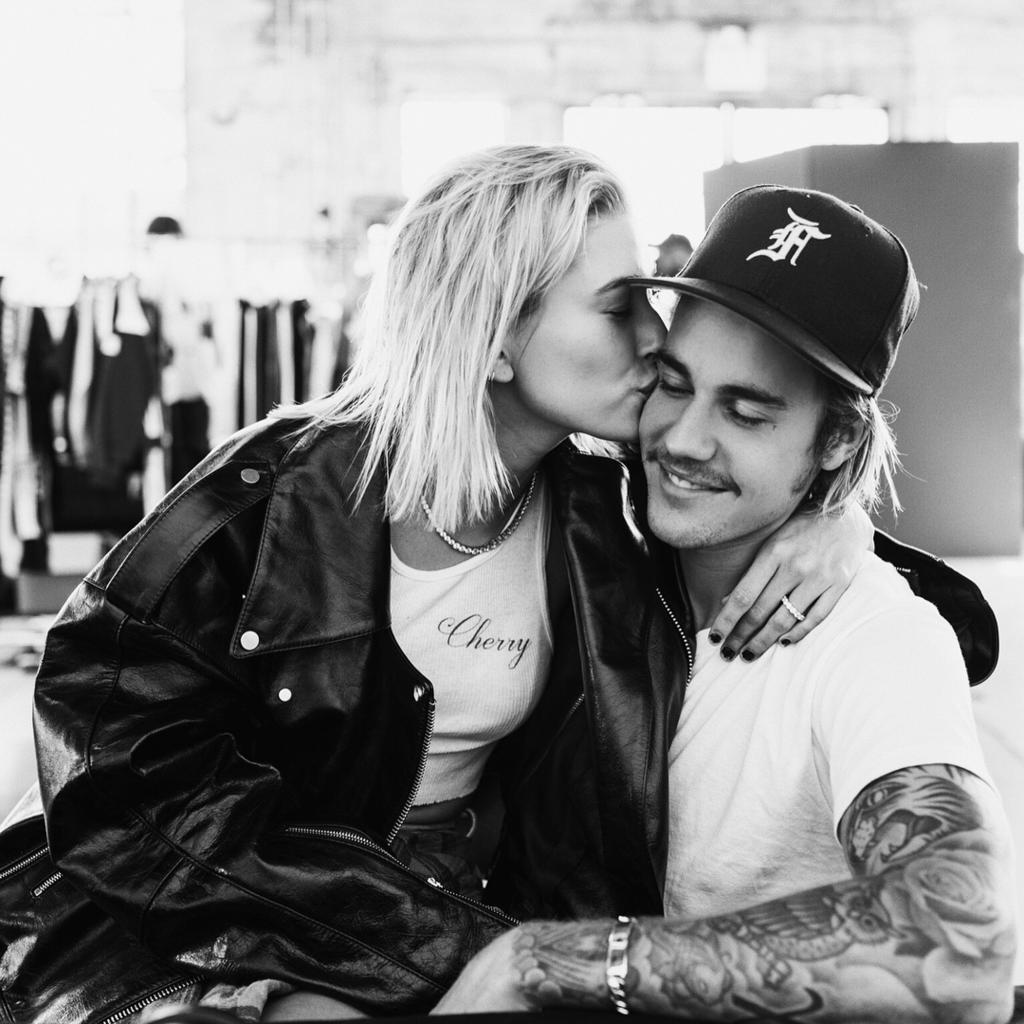 hailey bieber kissing justin bieber on the cheek