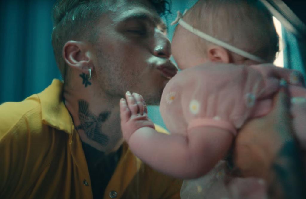 Fox shared a sweet moment with a baby girl in Friday's "Lonely Road" music video.