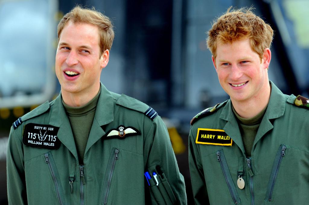 Prince William and Prince Harry in military boiler suits in June 2009.