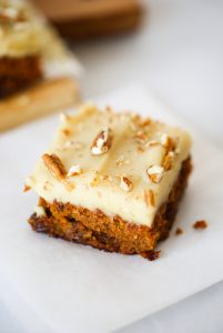 Paleo carrot cake made with sweet potatoes instead of flour. 159 calorie gluten free carrot cake. This cake is so delicious you won't even know it's healthy! Whipped lemon frosting is also made from sweet potatoes! #paleo #baking #cake #recipes #dessert