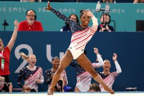 Members of Team United States celebrate after Simone Biles' routine in the floor exercise during the Artistic Gymnastics Women's Team Final on day four of the Olympic Games Paris 2024 at Bercy Arena on July 30, 2024 in Paris, France.