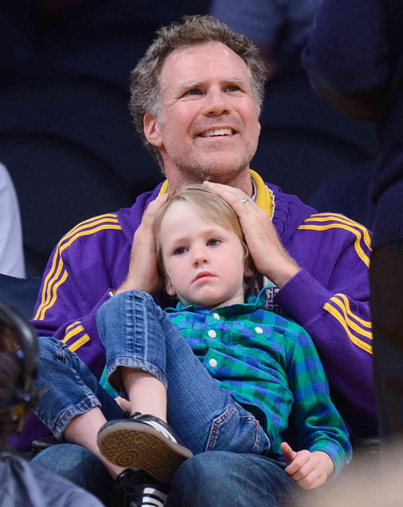 Will Ferrell and his son Axel Ferrell attend a basketball game between the Brooklyn Nets and the Los Angeles Lakers at Staples Center on February 23, 2014 in Los Angeles, California