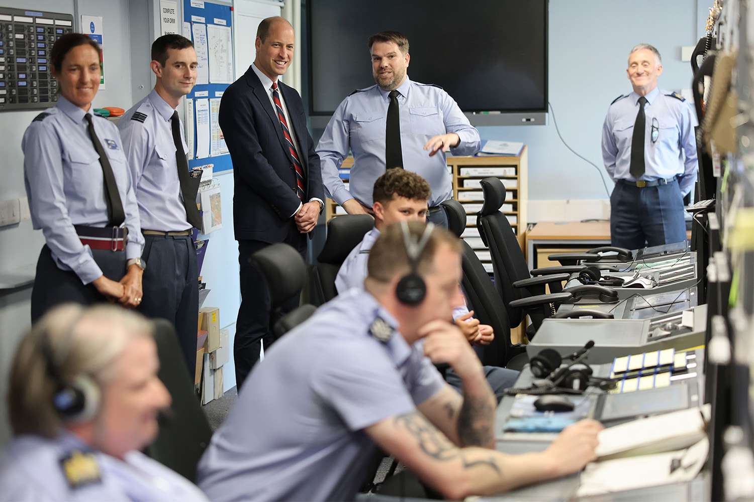 Prince William, Prince of Wales talks to base personnel inside the Air Traffic Control Tower during an official visit at RAF Valley on July 09, 2024 in Holyhead, United Kingdom