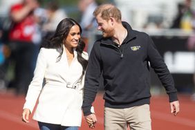 Prince Harry, Duke of Sussex and Meghan, Duchess of Sussex attend the athletics on day two of the Invictus Games 2020 at Zuiderpark on April 17, 2022 in The Hague, Netherlands. 