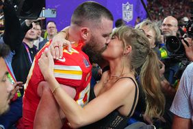 City Chiefs Travis Kelce (87) kisses girlfriend and singer Taylor Swift following victory vs San Francisco 49ers at Allegiant Stadium. 