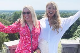 Christie Brinkley poses with friend in white button up top