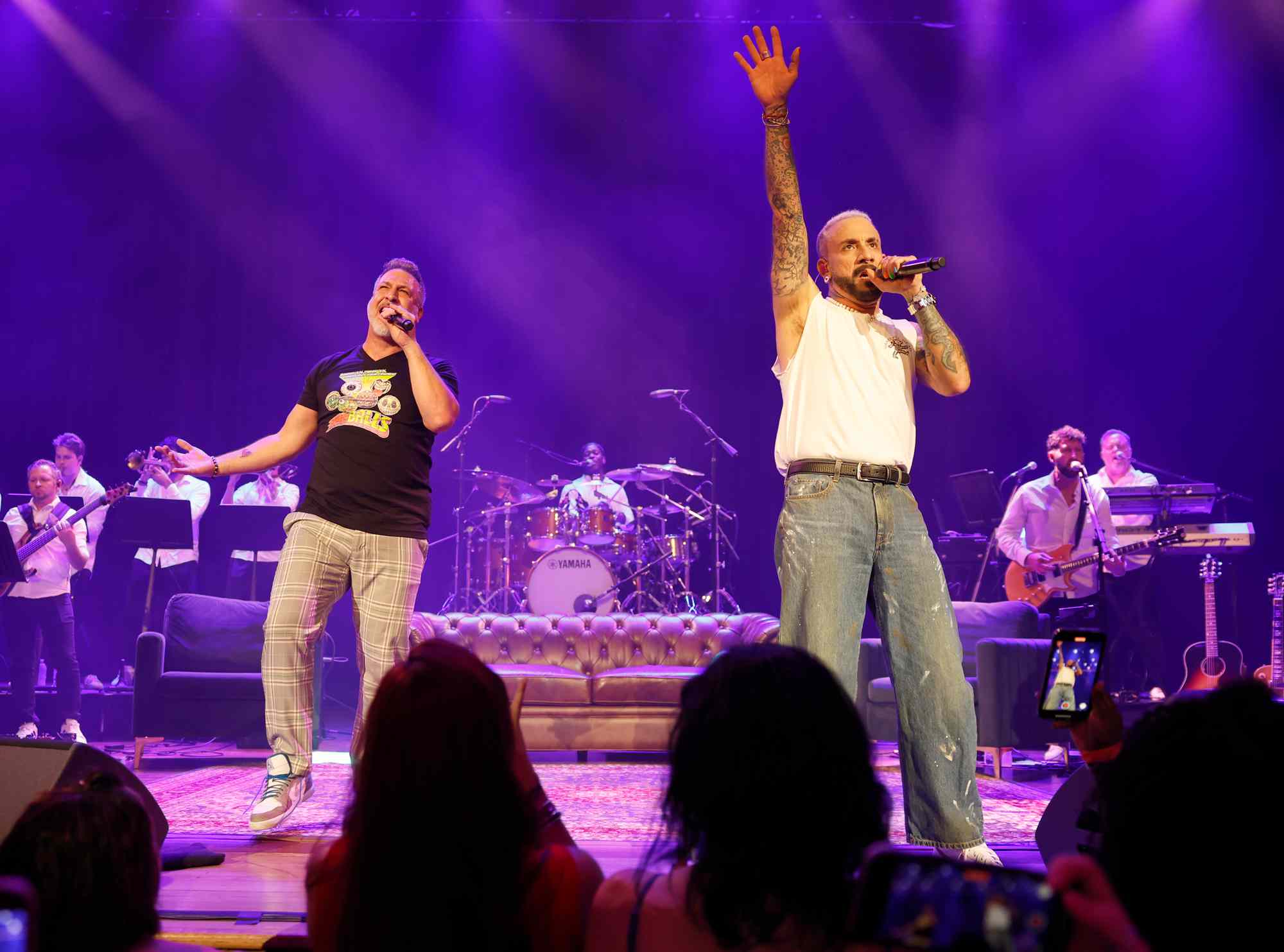 Joey Fatone and AJ McLean perform at the Ryman Auditorium on June 28, 2024 in Nashville, Tennessee.