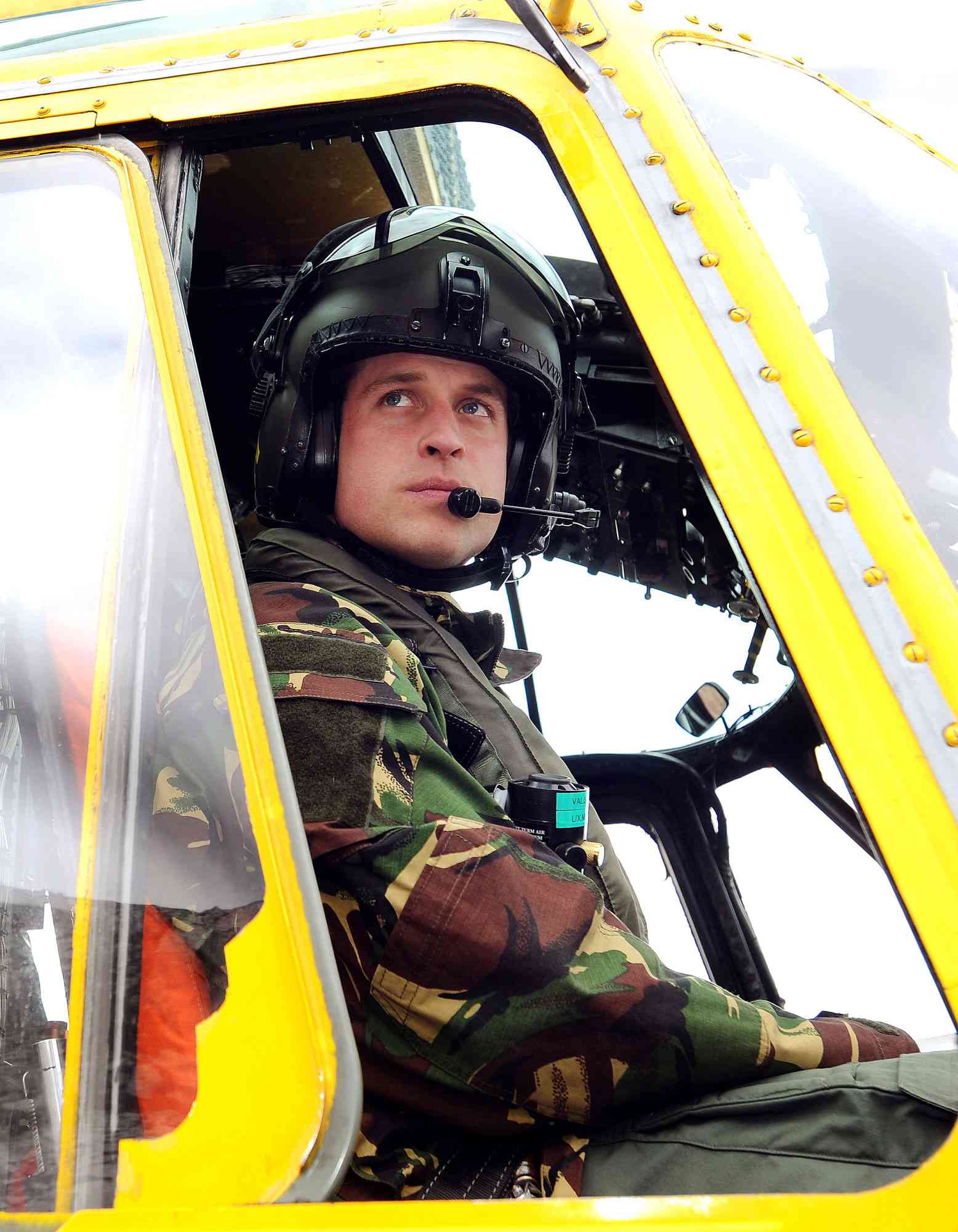 This file picture taken on March 31, 2011 shows Britain's Prince William at the controls of a Sea King helicopter during a training exercise at Holyhead Mountain, having flown from RAF Valley in Anglesey, north Wales. Prince William spent his 29th birthday at work as a Royal Air Force helicopter pilot on Tuesday June 21, 2011, in a far cry from the pomp and ceremony that surrounded his marriage to Kate Middleton just weeks ago. The son of Prince Charles and the late Princess Diana will be on duty at a RAF search and rescue base in Anglesey, north Wales, waiting for possible emergency call-outs, said Clarence House, his official residence.