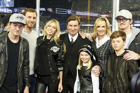 Ty Gretzky, Dustin Johnson, Paulina Gretzky, Emma Gretzky, Janet Jones Gretzky, Wayne Gretzky, Tristan Gretzky and Trevor Gretzky in stands before a Dodgers game vs Anaheim Ducks on January 25, 2014.