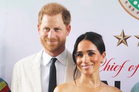 Britain's Prince Harry, Duke of Sussex, and Britain's Meghan, Duchess of Sussex, pose for a photo as they attend the program held in the Armed Forces Complex in Abuja, Nigeria on May 11, 2024.