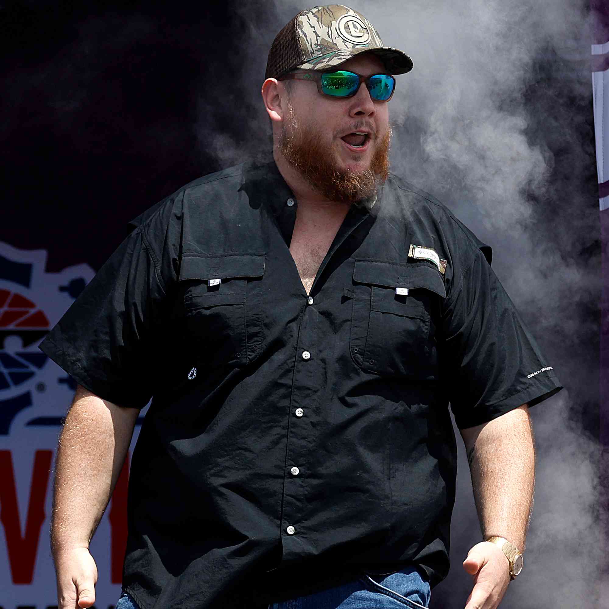 Singer Luke Combs walks onstage during pre-race ceremonies prior to the NASCAR Cup Series Ally 400 at Nashville Superspeedway on June 30, 2024