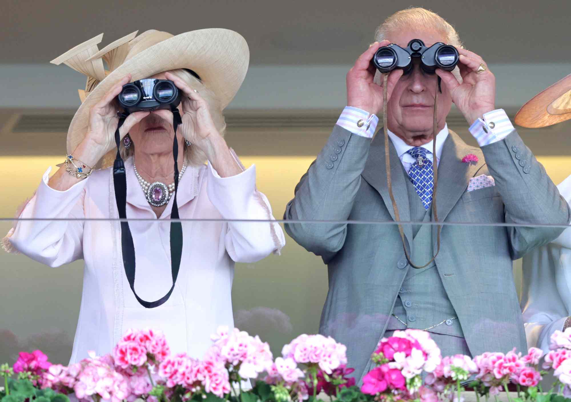 Queen Camilla and King Charles III watch a race during day two of Royal Ascot 2023 at Ascot Racecourse on June 21, 2023 in Ascot, England.