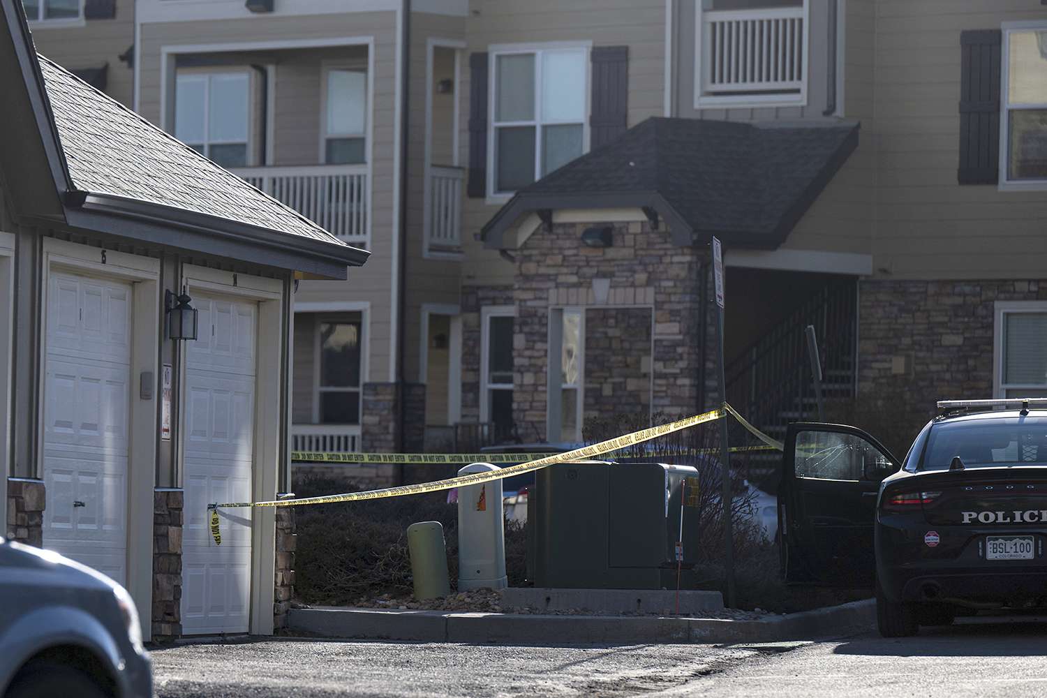 Police tape marks a crime scene where Colorado Springs police found children dead inside a condo of the Palomino Ranch Point complex after responding to a 911 call reporting a burglary, Tuesday, Dec. 19, 2023, in Colorado Springs, Colo.