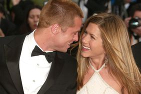 Brad Pitt and wife actress Jennifer Aniston attend the World Premiere of the epic movie "Troy" at Le Palais de Festival on May 13, 2004 in Cannes, France