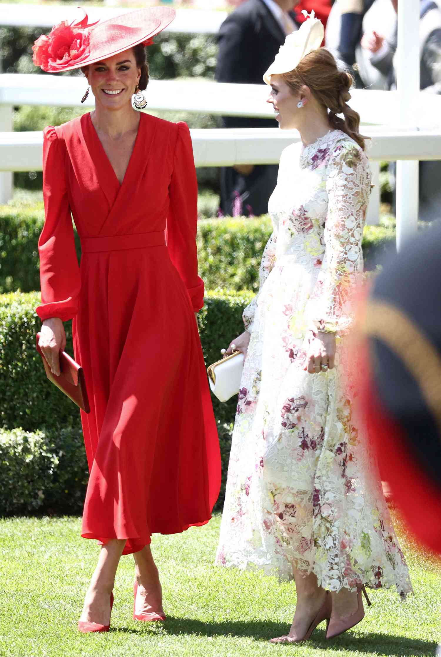 Catherine, Princess of Wales (L) speaks with Britain's Princess Beatrice of York (R) ahead of racing on the fourth day of the Royal Ascot horse racing meeting in Ascot