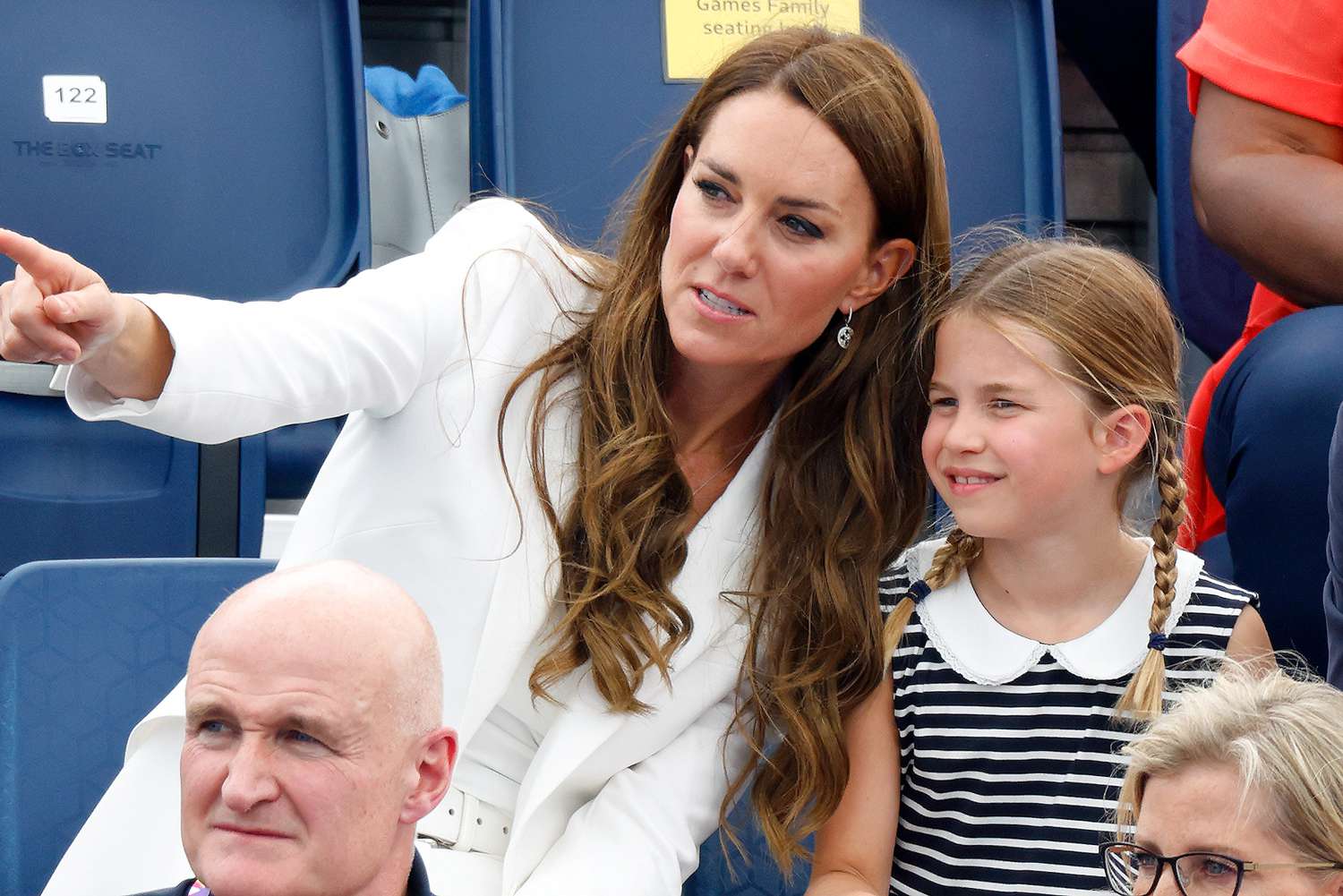 Catherine, Duchess of Cambridge, Princess Charlotte of Cambridge and Prince William, Duke of Cambridge watch the England v India Women's hockey match