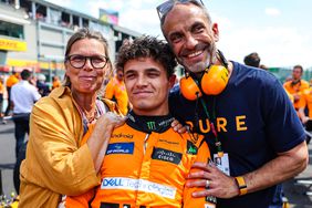 Lando Norris with father Adam and mother Cisca pose on the grid during the F1 Grand Prix of Belgium on July 28, 2024.