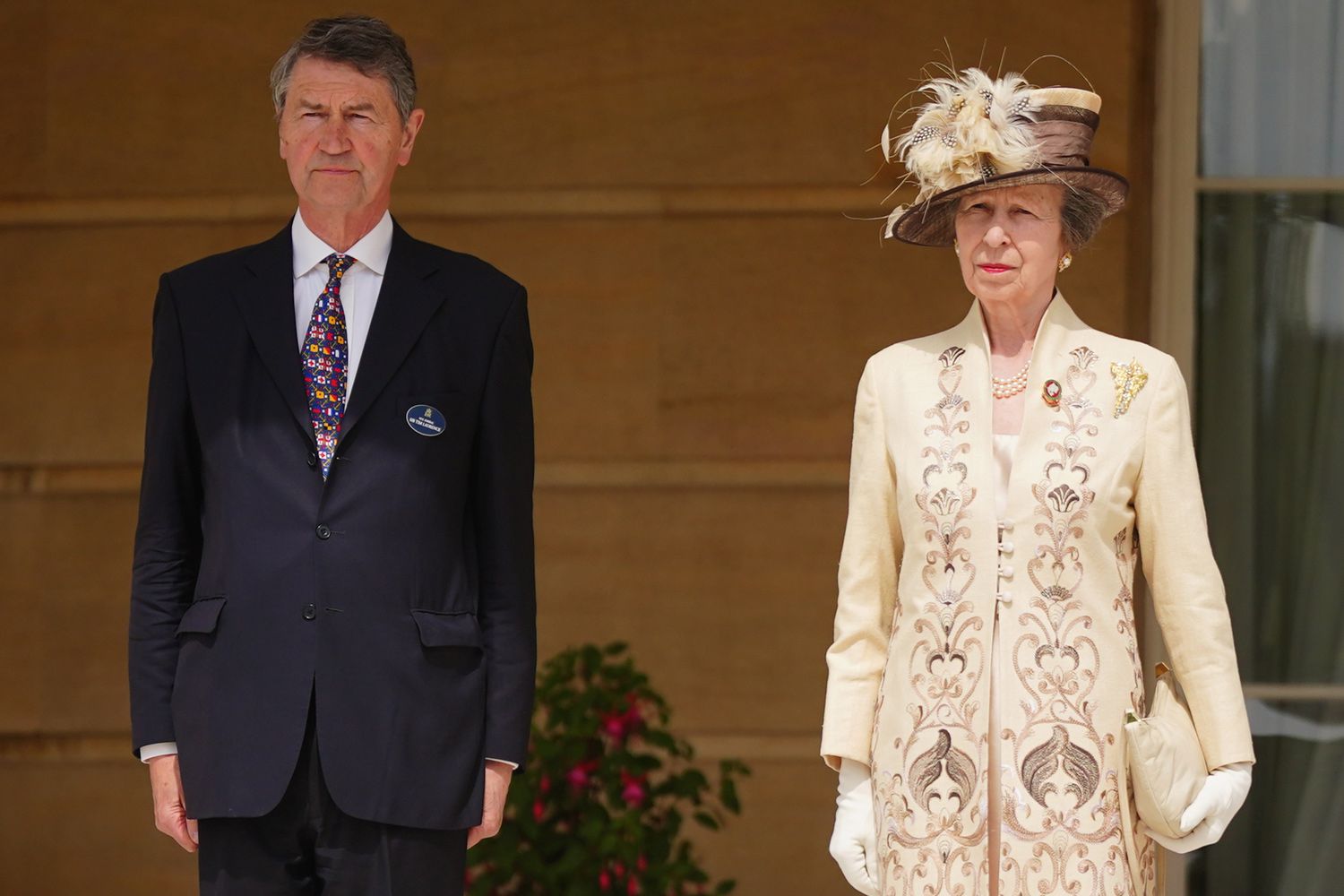 Princess Anne, Princess Royal accompanied by Vice Admiral Sir Tim Laurence speak to guests as they attend the Not Forgotten Association Annual Garden Party at Buckingham Palace on May 17, 2024