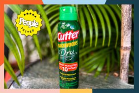 bottle of Cutter Backwoods Dry Spray surrounded by leaves