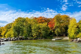 A natural view of stony point Leech Lake and autumnal forest in Minesota, USA under a clear sky