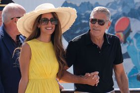 George Clooney and his wife Amal arrive in Venice ahead of the city\'s film festival.