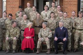 Camilla, the Queen Consort and Colonel of the Grenadier Guards, poses for a group photo as she visits Lille Barracks