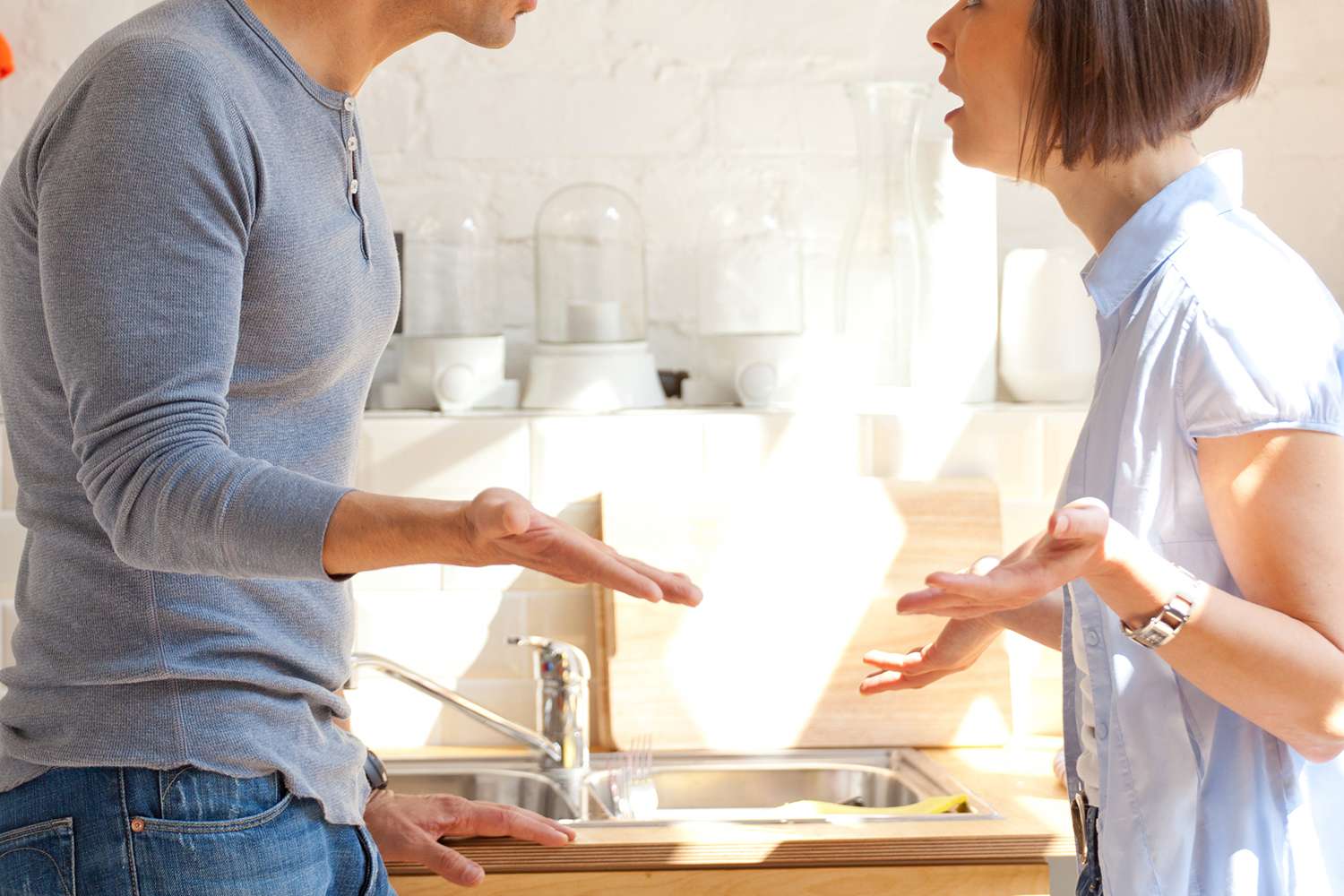 Couple having an animated discussion in the kitchen