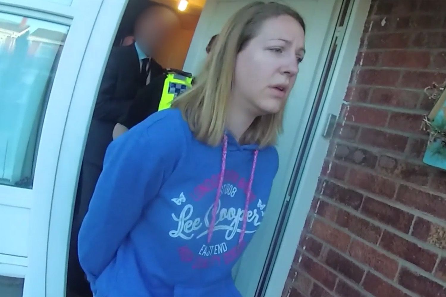 A screenshot from footage of Lucy Letby's first arrest at her home in Chester on 3 July 2018.
