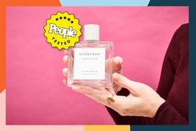 Hands holding the All Saints Sunset Riot Eau de Parfum in front of a pink background with a People Tested badge. 