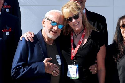 Former astronaut Buzz Aldrin (center left), accompanied by his daughter, Janice Aldrin