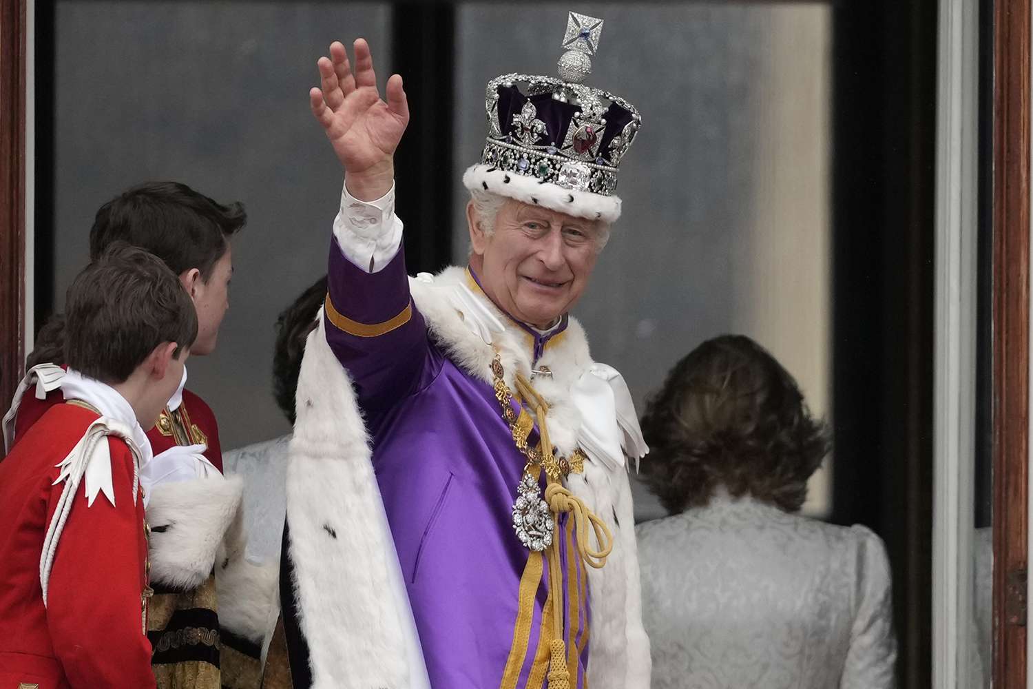 King Charles III waves from The Buckingham Palace balcony during the Coronation of King Charles III