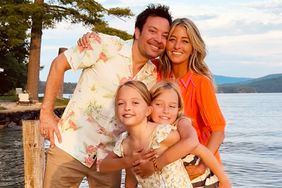 Jimmy Fallon poses with family on lake dock